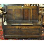 19th Century Welsh oak settle of small proportions, having four moulded panels to the back, with