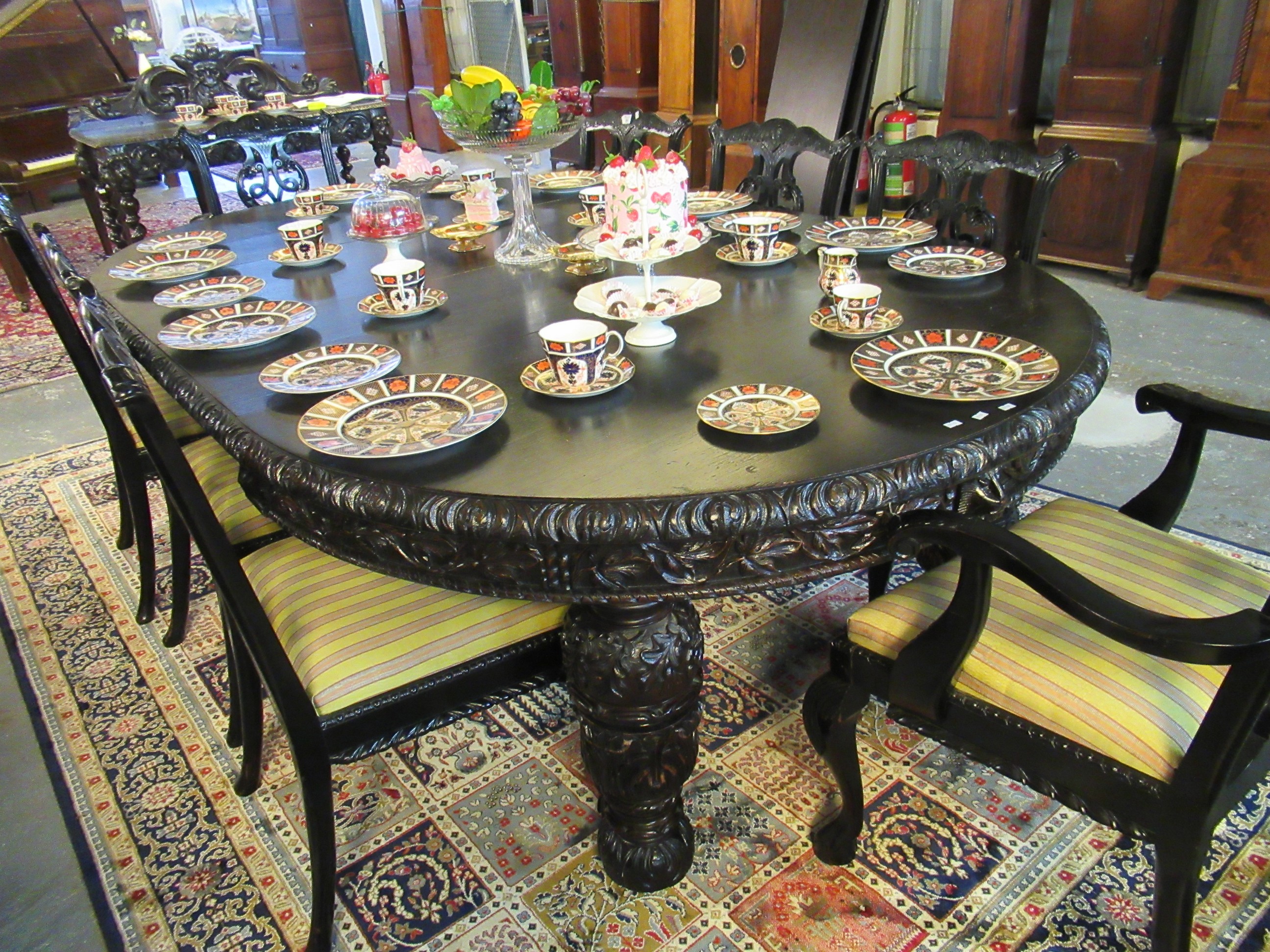 Late Victorian stained oak extending dining table with three additional leaves and winder. The - Image 8 of 11