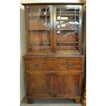 Early 19th Century mahogany two stage secretaire bookcase, the moulded cornice above two glazed