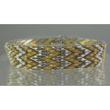 18ct three colour gold bracelet. Width 12mm. Approx weight 57.7 grams. (B.P. 21% + VAT)