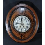 Late 19th/early 20th Century French 8 day oval shaped 'vineyard' wall clock, the walnut case with
