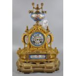 19th Century French gilt spelter architectural mantel clock with French porcelain panels,