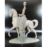 Lladro Spanish porcelain figure modelled as a lady sat side saddle on a horse on naturalistic