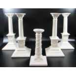 Collection of Royal creamware 'Occasions' Corinthian column candlesticks with relief swag