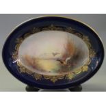 Early 20th Century Royal Worcester oval dish with cobalt blue and gilded foliate borders, the centre
