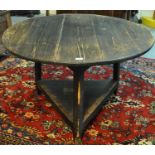 19th Century traditional Welsh stained pine cricket table of large proportions. 111cm in diameter,