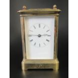 French brass carriage clock striking on one gong with full depth enamel dial. 14cm high approx. (B.
