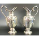 Pair of sterling silver wine jugs, by Garrard to commemorate the silver wedding anniversary 1947 -
