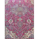 Multi-coloured ground vintage Persian Tabrez rug having geometric floral and foliate designs. 148