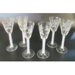 Set of six hive shaped wine glasses with wheel engraved trailing vine decoration and multiple opaque