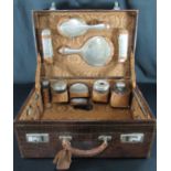 George V ladies silver travelling vanity simulated crocodile case, the interior revealing assorted
