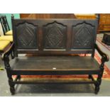 18th Century style oak settle, the moulded ogee three fielded back with carved lozenge decoration,
