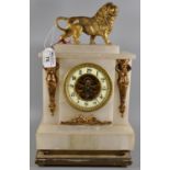 Late 19th Century alabaster mantel clock in empire style, the case surmounted by a male lion and