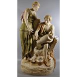 Royal Dux porcelain figure group of a Greek potter and his lady inscribing a vase in his hand,