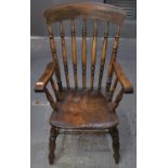 Late 19th/early 20th Century beech and elm farmhouse elbow chair, the spindle back with shaped