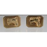 Pair of 9ct gold cufflinks decorated in relief with horse's heads. 20mm x 14mm. Approx weight in