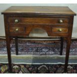 Early 19th Century oak lowboy, the moulded top above an arrangement of one long and two short