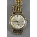 Omega 9ct gold 'Ladymatic' automatic ladies wristwatch with 9ct gold gate bracelet strap, the face