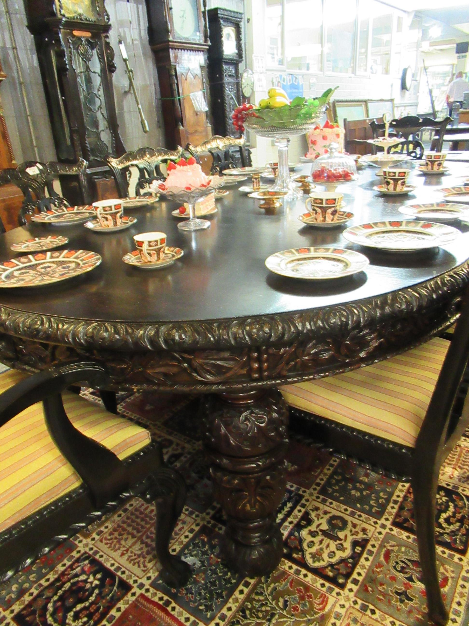 Late Victorian stained oak extending dining table with three additional leaves and winder. The - Image 7 of 11