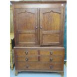 Early 19th Century Welsh oak press cupboard, the moulded cornice above two blind panelled ogee