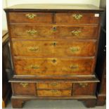 18th Century walnut chest on stand, the moulded top above an arrangement of two short and three long