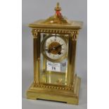 Early 20th Century brass four glass mantel clock having ceramic Roman chapter ring, two train