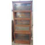 Early 20th Century oak five sectional Globe Wernicke bookcase with metal banding and under drawer.