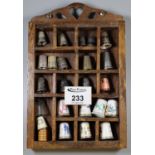 Wooden thimble cabinet with assorted thimbles. (B.P. 21% + VAT)