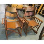 Pair of stained rocking folding armchairs with leather backs one is labelled 'Costa Rica'. (2)