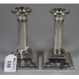 Pair of Edward VII silver candlesticks on square stepped bases, 13cm high approx. (B.P. 21% + VAT)