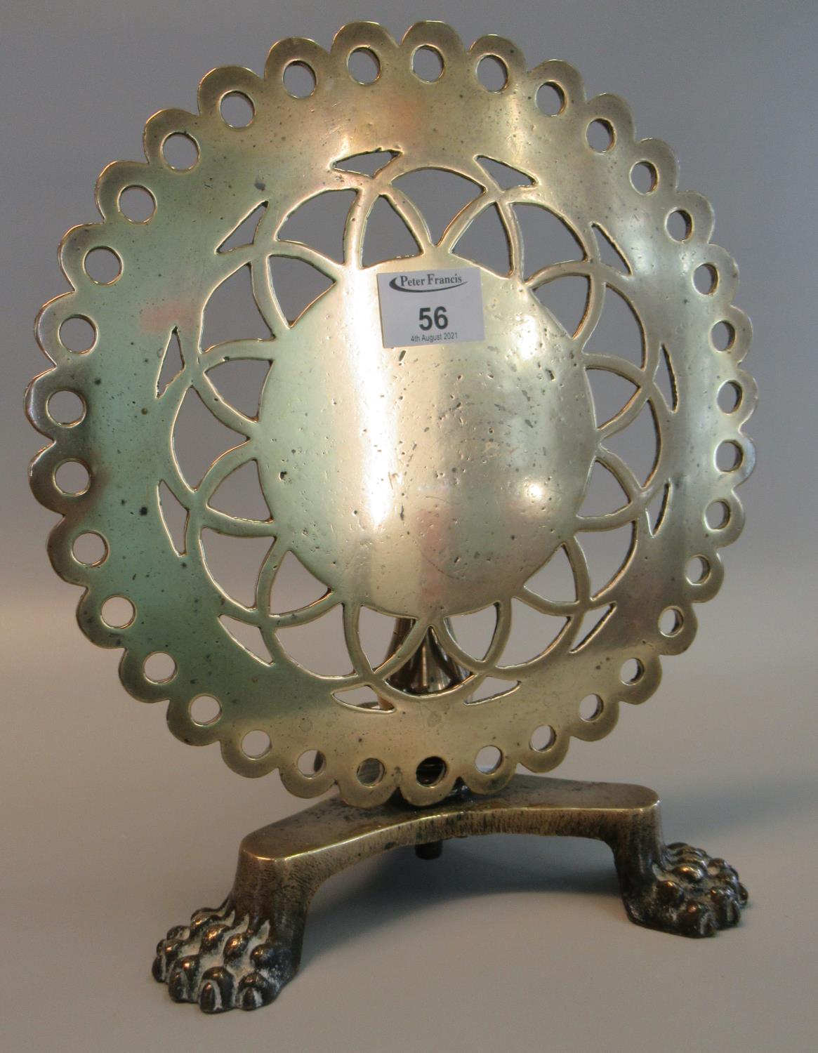 19th Century brass trivet in the form of a pierced circular snap top pedestal table on triform