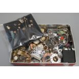 Tin box containing assorted watches, lapel pins, costume jewellery, dress rings etc. (B.P. 21% +