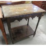 Heavily carved oak lamp or side table with under tier on turned legs. (B.P. 21% + VAT)