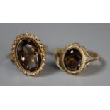 Two 9ct gold smokey quartz rings. Both size M. Approx weight 6.1 grams. (B.P. 21% + VAT)