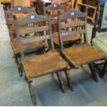Set of four oak bar back chairs, having leather seats and X frame supports. 94) (B.P. 21% + VAT)