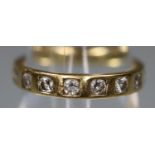 18ct gold court shaped half eternity style ring set with eight diamonds. Ring size K. Approx