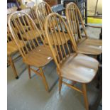 A set of four Ercol style hoop and spindle back kitchen chairs. (4) (B.P. 21% + VAT)