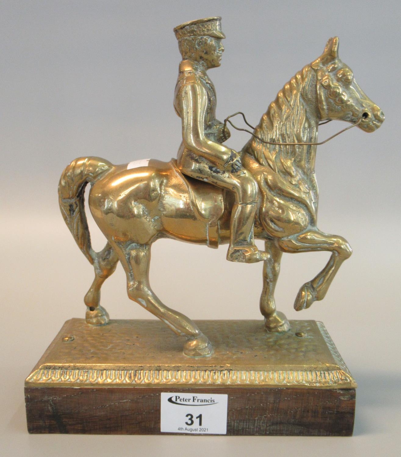 Cast brass figure of a mounted British military officer, probably Lord Kitchener ,on square wooden