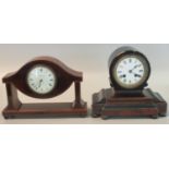 Edwardian mahogany inlaid mantel clock marked 'Waring & Gillow, London', standing on bun feet.