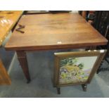 Early 20th Century oak extending dining table with winder, on square tapering legs and casters, with