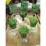 Set of four green flash cut hock glasses, together with three other green flash cut sherry