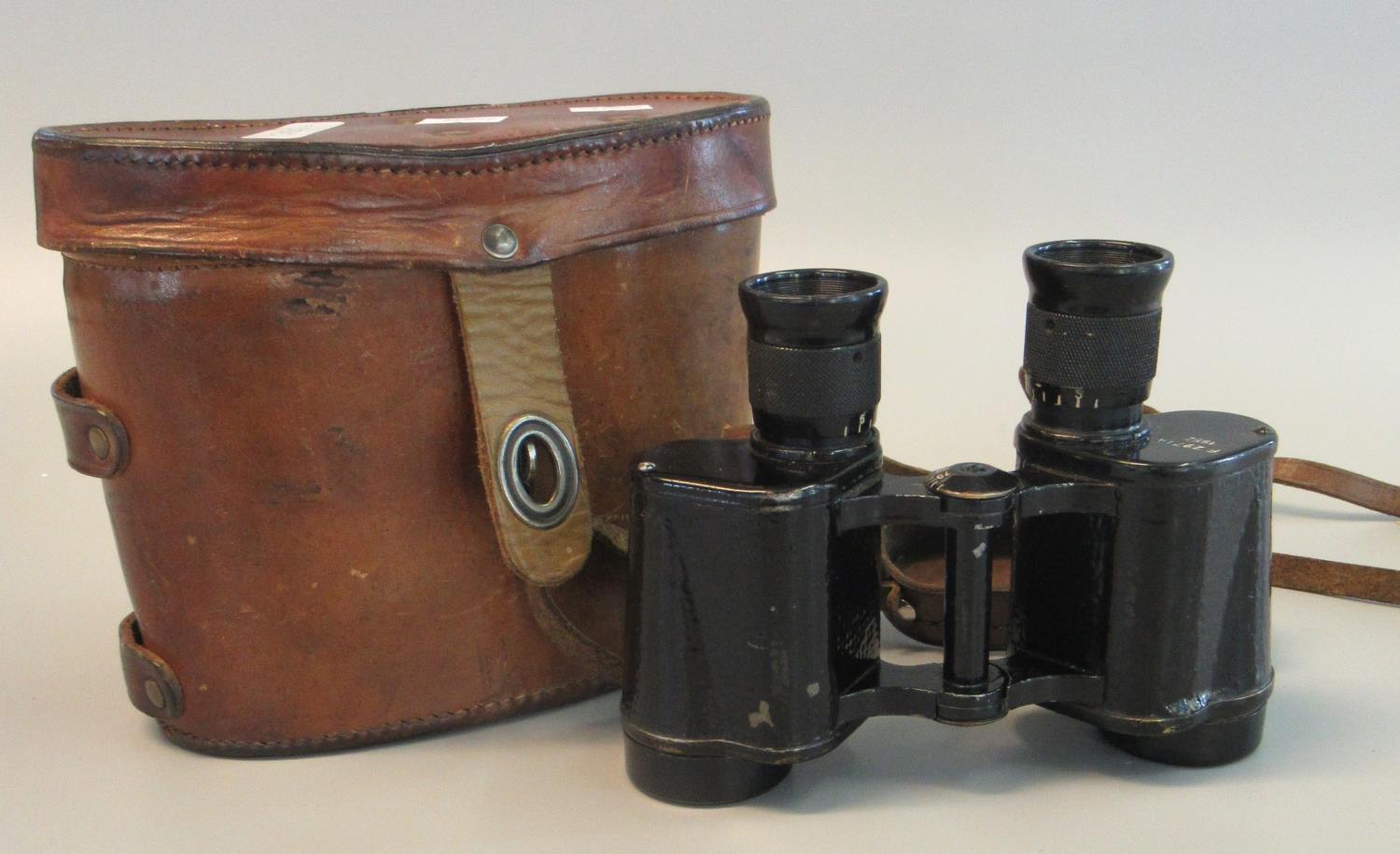 Pair of probably British military binoculars or field glasses in original leather case, bearing