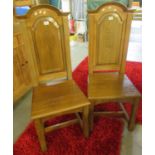 Pair of Arts and Crafts style oak high back chapel chairs. Provenance from Bethesda Baptist's