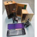 Black enamelled and lacquered brass monocular microscope in fitted wooden case, a modern small