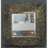 Repousse framed mirror with bevel plate. Overall 46 x 44cm approx. (B.P. 21% + VAT)