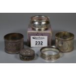 Four silver napkin rings and silver pill box with hinged lid. 2.3 troy ozs approx. (B.P. 21% + VAT)