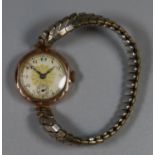 Early 20th Century 9ct gold ladies wristwatch with plated expanding bracelet and Arabic face. (B.