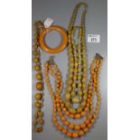 Collection of orange Bakelite and plastic jewellery. (B.P. 21% + VAT)