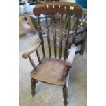 Late 19th/early 20th Century elm and beech spindle back farmhouse elbow chair. (B.P. 21% + VAT)