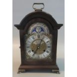 Reproduction battery operated bracket type clock with moon face marked 'St James, London'. (B.P. 21%